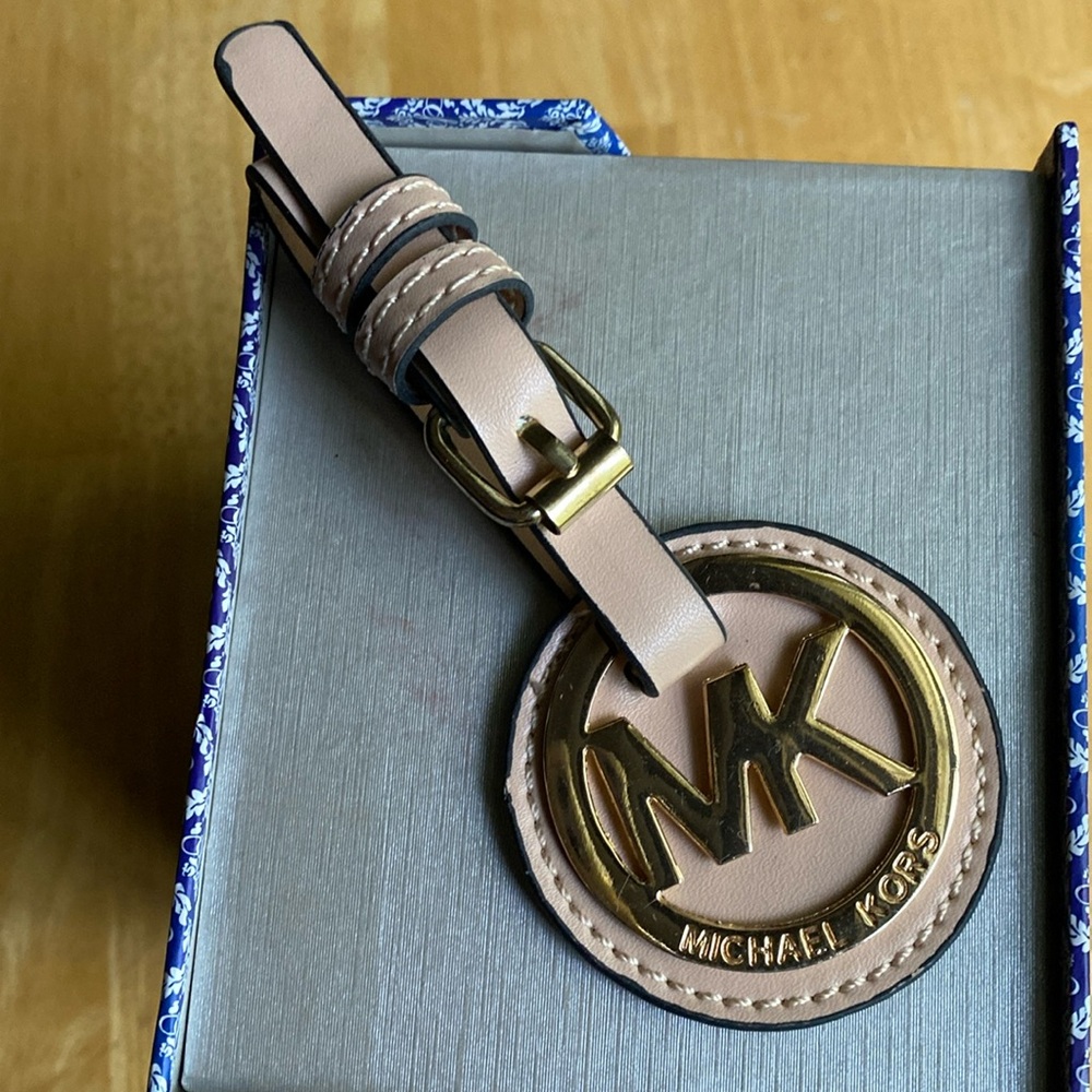 Michael Kors bag charm in good condition